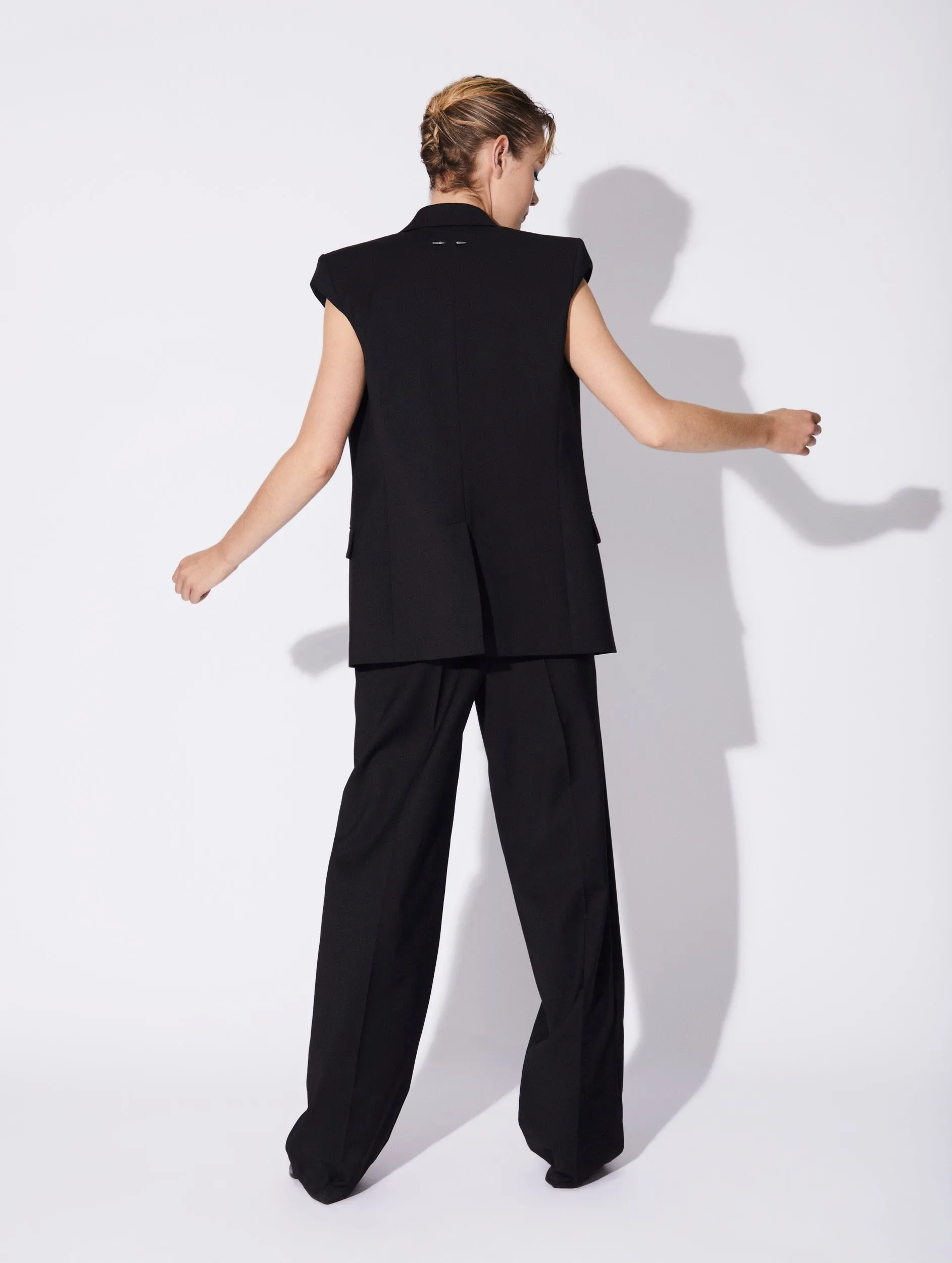 Black stretch wool gabardine sleeveless jacket